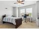 Bright bedroom with natural light and neutral carpet featuring a cozy bed and a desk area at 2307 Candleglow St, Castle Rock, CO 80109