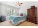 Cozy bedroom featuring a ceiling fan, window with view, and coordinated furnishings at 2307 Candleglow St, Castle Rock, CO 80109