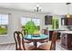 Breakfast nook with table, chairs and sliding doors leading to outdoor scenery at 2307 Candleglow St, Castle Rock, CO 80109