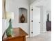 Stylish hallway with unique decor, arched niche, and an open doorway at 2307 Candleglow St, Castle Rock, CO 80109