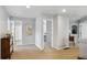 Bright hallway with neutral walls and carpet leading to rooms with light and airy ambiance and decorative artwork at 2307 Candleglow St, Castle Rock, CO 80109