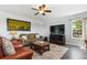 Comfortable living room with ceiling fan, sofa, and chairs offers relaxation and style at 2307 Candleglow St, Castle Rock, CO 80109