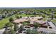 Aerial view of a community school surrounded by lush trees and playing fields at 2990 E 135Th Dr, Thornton, CO 80241
