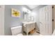 Clean bathroom featuring modern vanity, white tile, and contemporary finishes at 2990 E 135Th Dr, Thornton, CO 80241