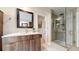 Modern bathroom with a glass-enclosed shower, a sleek vanity with a stone countertop and modern fixtures at 2990 E 135Th Dr, Thornton, CO 80241