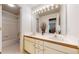Bright bathroom with dual sinks, modern fixtures, and a large mirror at 2990 E 135Th Dr, Thornton, CO 80241