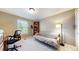 Versatile bedroom space featuring a futon, shelving, and natural light at 2990 E 135Th Dr, Thornton, CO 80241