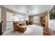 Lofted bonus room with neutral walls, a desk, chair, bookcase and comfortable seating area at 2990 E 135Th Dr, Thornton, CO 80241