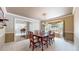 Formal dining room featuring a large wooden table with seating for eight, complemented by elegant decor and soft lighting at 2990 E 135Th Dr, Thornton, CO 80241