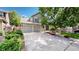 Charming home with a two-car garage, mature landscaping, and a manicured front yard at 2990 E 135Th Dr, Thornton, CO 80241