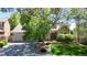 Charming brick home featuring a well-manicured lawn, mature trees, and a two-car garage in a lovely neighborhood at 2990 E 135Th Dr, Thornton, CO 80241