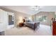 Tranquil bedroom with a vaulted ceiling, a cozy bed, a ceiling fan and a bright window offering natural light at 2990 E 135Th Dr, Thornton, CO 80241