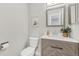 This powder room boasts a modern vanity with stylish fixtures, complemented by a neutral color palette for a serene feel at 4929 W 73Rd Ave, Westminster, CO 80030