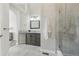 Bright bathroom with granite countertops, a glass-enclosed shower, and an arched doorway, a relaxing and modern design at 4929 W 73Rd Ave, Westminster, CO 80030