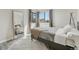 This bedroom features natural light, and a full-length mirror with a neutral color palette for a restful retreat at 4929 W 73Rd Ave, Westminster, CO 80030