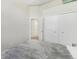 Minimalist bedroom with a closet with sliding doors, neutral color palette, and carpet flooring at 4929 W 73Rd Ave, Westminster, CO 80030