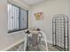 Cozy dining area with a small table, artwork, and a modern wine rack at 4929 W 73Rd Ave, Westminster, CO 80030