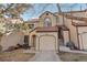 Charming townhome featuring a stucco facade, red tile roof, and attached garage at 4929 W 73Rd Ave, Westminster, CO 80030