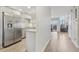 Bright open-concept kitchen with stainless appliances, granite countertops, and adjacent living space at 4929 W 73Rd Ave, Westminster, CO 80030