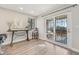 Open floor plan with sliding glass doors to the patio and a table and chairs set for comfortable lounging at 4929 W 73Rd Ave, Westminster, CO 80030