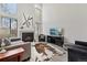 Bright living room with tall windows, fireplace, and modern decor at 4929 W 73Rd Ave, Westminster, CO 80030