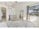 Spacious main bedroom with vaulted ceilings, a dresser, and a large window provides ample natural light and storage at 4929 W 73Rd Ave, Westminster, CO 80030