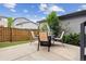 Backyard featuring a patio with an outdoor dining set and low-maintenance artificial turf at 9682 Dunning Cir, Highlands Ranch, CO 80126