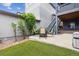 Cozy backyard featuring low maintenance turf, a small garden and a charming outdoor seating area at 9682 Dunning Cir, Highlands Ranch, CO 80126