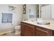 Modern bathroom with updated vanity, neutral walls, decor, and tiled flooring at 9682 Dunning Cir, Highlands Ranch, CO 80126