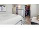 Cozy bedroom featuring a walk-in closet, ensuite bathroom, and natural lighting at 9682 Dunning Cir, Highlands Ranch, CO 80126