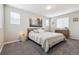 Bright bedroom with large windows, soft carpet, and a cozy bed at 9682 Dunning Cir, Highlands Ranch, CO 80126