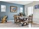 Inviting dining room with a modern wooden table set and ample natural light, perfect for Gathering meals at 9682 Dunning Cir, Highlands Ranch, CO 80126