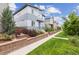This shows the exterior, including a bit of the yard, with a focus on the home's architecture and curb appeal at 9682 Dunning Cir, Highlands Ranch, CO 80126