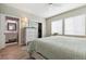 Spacious main bedroom with ensuite bathroom, closet with sliding door, neutral walls, and wood flooring at 9682 Dunning Cir, Highlands Ranch, CO 80126