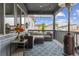 Relaxing covered patio featuring an outdoor seating area with a heater, perfect for enjoying the outdoors at 9682 Dunning Cir, Highlands Ranch, CO 80126