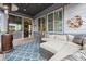 Outdoor patio with comfortable seating area, outdoor heater, and dining view inside at 9682 Dunning Cir, Highlands Ranch, CO 80126
