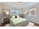 Inviting bedroom with neutral tones, natural light, and serene decor for relaxation and comfort at 1261 S Harrison St, Denver, CO 80210