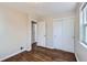 Cozy bedroom with wood floors, closet, and trim, offering comfort and style at 1261 S Harrison St, Denver, CO 80210