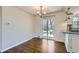 Bright dining room featuring hardwood floors, modern lighting, and sliding glass doors to the backyard at 1261 S Harrison St, Denver, CO 80210