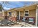 Inviting front porch with cozy seating, decorative accents, and stylish brick and siding details at 1261 S Harrison St, Denver, CO 80210