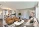 Bright and airy living room with hardwood floors, modern decor, and seamless flow to dining at 1261 S Harrison St, Denver, CO 80210