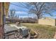 Backyard patio with seating and storage shed, ideal for outdoor relaxation at 1261 S Harrison St, Denver, CO 80210