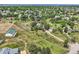 Picturesque aerial view of a sprawling property with a house, outbuilding, and verdant surroundings at 6351 S Andes Pl, Centennial, CO 80016