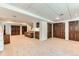 Finished basement with a cozy seating area, built-in cabinets, and multiple storage closets for ample space at 6351 S Andes Pl, Centennial, CO 80016