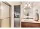 Well-maintained bathroom featuring a glass-enclosed shower and vanity with chrome fixtures, creating a refreshing space at 6351 S Andes Pl, Centennial, CO 80016