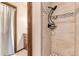 Updated bathroom with tiled shower, modern fixtures, and a functional layout enhances daily routines at 6351 S Andes Pl, Centennial, CO 80016
