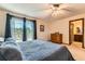 Bedroom with balcony, fan, and closet, provides a comfortable and relaxing atmosphere at 6351 S Andes Pl, Centennial, CO 80016