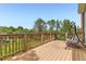 Relaxing deck overlooking a lush green yard, complete with a swing for enjoying the serene outdoor views at 6351 S Andes Pl, Centennial, CO 80016