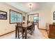 Cozy dining area featuring natural light, wood accents and views to the main living area at 6351 S Andes Pl, Centennial, CO 80016