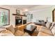 Cozy living room with fireplace and mantle offers a relaxing space to unwind and enjoy the open space at 6351 S Andes Pl, Centennial, CO 80016